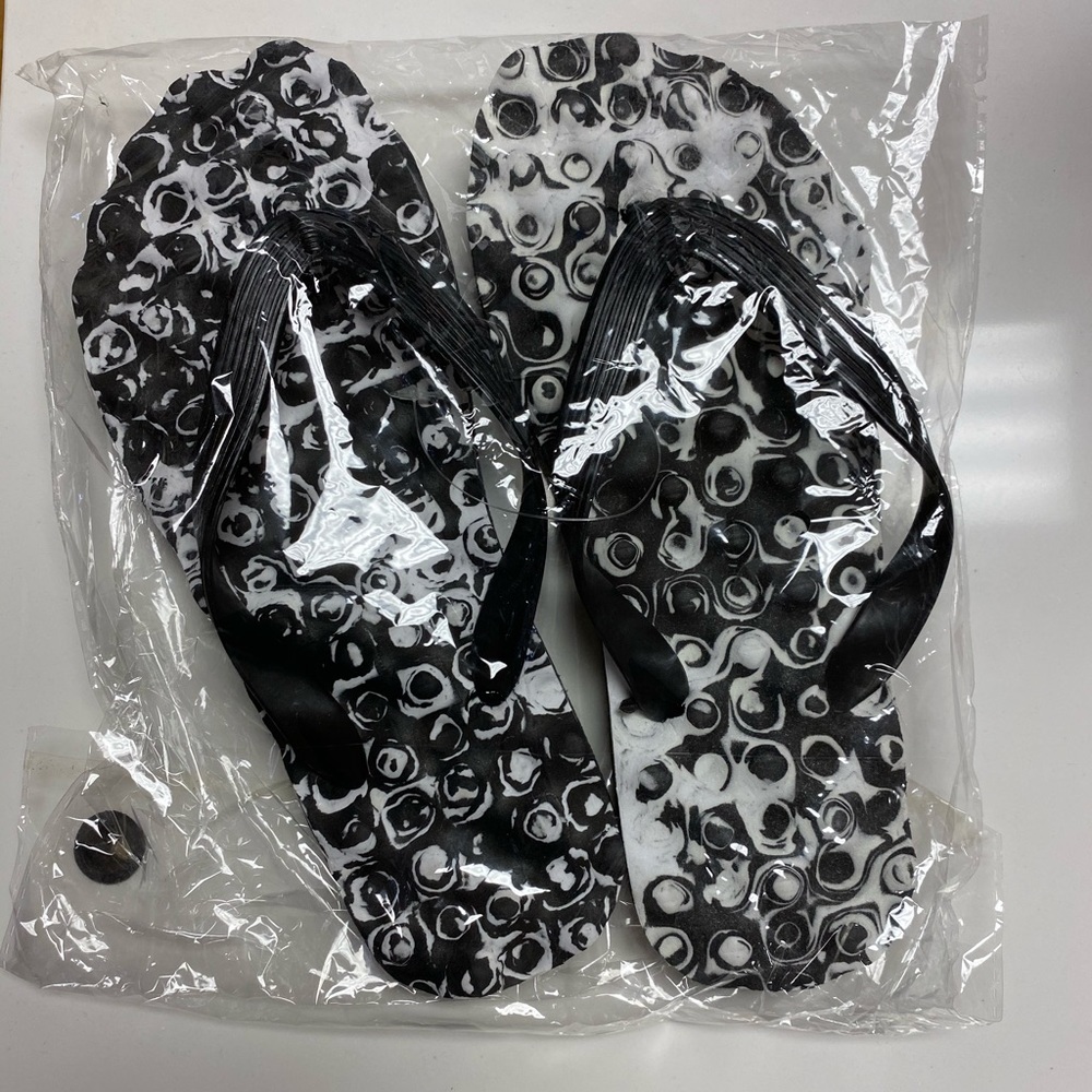 Women’s Black and White Flip Flops size 7/8